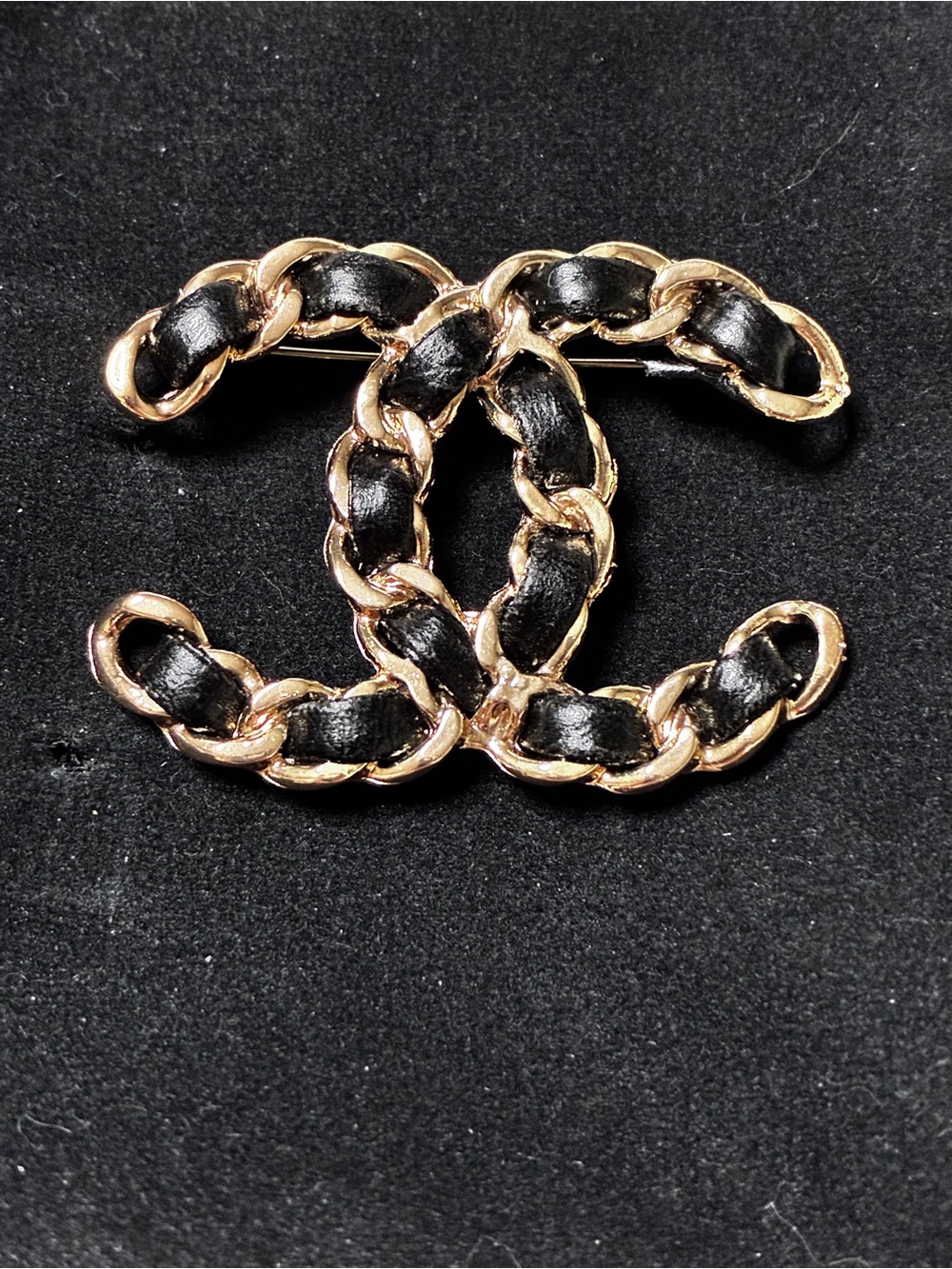 Double C Logo Gold Tone Chain with Black Braided Leather Brooch